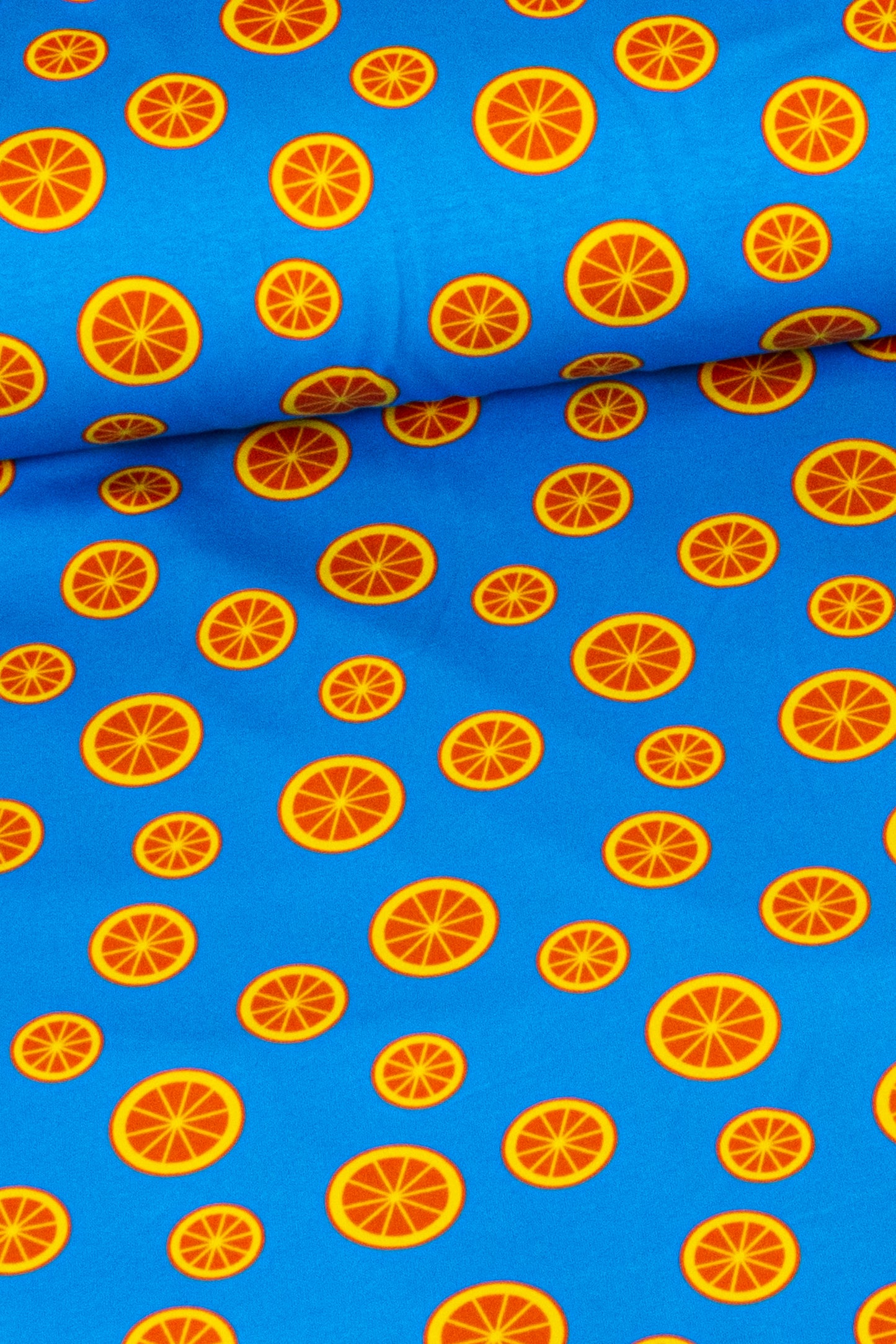 Jersey 'Orange Bubbles', Orangen auf Blau  (Preis pro halben Meter)
